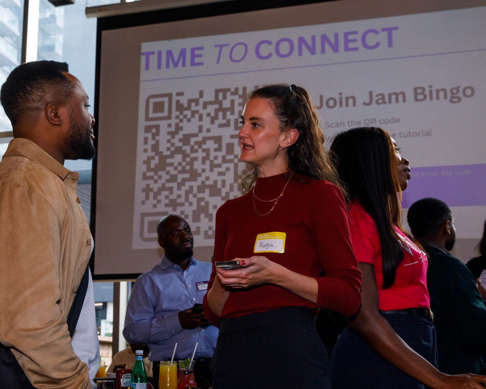 Attendees meeting new people at a Jam Bingo event