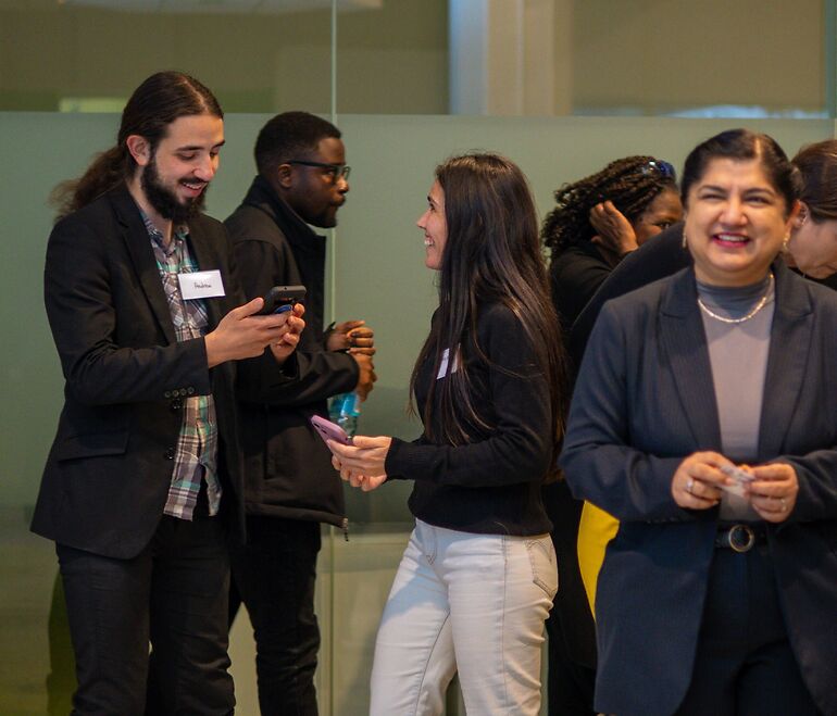 University students laughing during an icebreaker activity